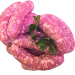 Salsiccia bianca dolce cruda, legata a mano con prezzemolo fresco, ideale per cottura al forno, alla brace o in padella.